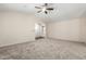 Bright, open living room featuring neutral carpet, vaulted ceiling, and direct entry at 12838 W Desert Mirage Dr, Peoria, AZ 85383