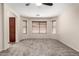 Carpeted main bedroom with ceiling fan, recessed lighting, and multiple windows at 12838 W Desert Mirage Dr, Peoria, AZ 85383