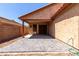 Covered patio with a hardscaped surface, providing the perfect spot for outdoor relaxation at 12838 W Desert Mirage Dr, Peoria, AZ 85383