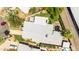 Overhead view of home with gray roof, patio area, lush landscaping and palm trees at 1329 E Catalina Dr, Phoenix, AZ 85014