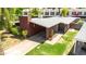 Aerial view of home featuring a carport, neatly manicured lawn and desert landscaping at 1329 E Catalina Dr, Phoenix, AZ 85014
