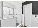 Contemporary bathroom with a frameless glass shower door and neutral color scheme at 1329 E Catalina Dr, Phoenix, AZ 85014