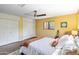 Bright bedroom with built-in storage, ceiling fan, and cozy decor at 1329 E Catalina Dr, Phoenix, AZ 85014