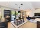 A dining area with a black table and chairs, sliding glass doors to the patio, and sleek furnishings at 1329 E Catalina Dr, Phoenix, AZ 85014
