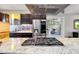Close up of an island with granite countertop, gas cooktop, and stainless steel refrigerator at 1329 E Catalina Dr, Phoenix, AZ 85014