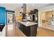 Kitchen view showcasing a large island with seating and stainless steel appliances at 1329 E Catalina Dr, Phoenix, AZ 85014