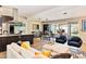 Bright, open-concept living space connected to the kitchen, featuring modern furniture and a seamless indoor/outdoor flow at 1329 E Catalina Dr, Phoenix, AZ 85014
