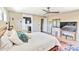 The main bedroom features a stylish ceiling fan, private bathroom and entertainment area at 1329 E Catalina Dr, Phoenix, AZ 85014