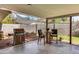 Covered patio with a grill, seating, and outdoor dining area at 1329 E Catalina Dr, Phoenix, AZ 85014