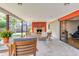 Covered patio with a stone fireplace and comfortable seating area at 1329 E Catalina Dr, Phoenix, AZ 85014