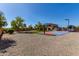 Sprawling backyard with basketball court, gazebo, RV parking and home at 14107 W Christy Dr, Surprise, AZ 85379