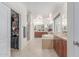 Large bathroom featuring dual vanities, a soaking tub, and a walk-in shower at 14107 W Christy Dr, Surprise, AZ 85379