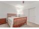 Bedroom featuring a wooden bed frame, closet, ceiling fan, and natural light at 14107 W Christy Dr, Surprise, AZ 85379