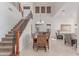 Elegant dining area next to stairs with high ceiling and lots of natural light, perfect for Gathering gatherings at 14107 W Christy Dr, Surprise, AZ 85379
