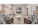 Bright living room with plush sofas, stylish chairs, and large windows, offering comfortable seating and natural light at 14107 W Christy Dr, Surprise, AZ 85379