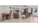 Cozy living room features a built-in shelving unit and comfortable seating, perfect for relaxation and entertainment at 14107 W Christy Dr, Surprise, AZ 85379