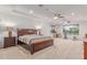 Spacious main bedroom featuring carpeted flooring, recessed lighting, and an exercise area at 14107 W Christy Dr, Surprise, AZ 85379