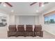 Home theater features cozy seating and a large screen, perfect for movie nights at 14107 W Christy Dr, Surprise, AZ 85379