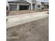 New construction house with a three-car garage and brick paver driveway at 14800 W Lariat Ln, Surprise, AZ 85387