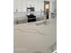 Kitchen featuring white cabinetry, a stainless-steel appliance suite, and white countertops at 14800 W Lariat Ln, Surprise, AZ 85387