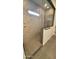 Modern shower with patterned tile, frameless glass, and sleek fixtures, offering a spa-like experience at 14800 W Lariat Ln, Surprise, AZ 85387
