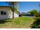 Lush backyard with a covered patio, grill, and pool view; perfect for relaxation and outdoor gatherings at 15212 N 37Th Ave, Phoenix, AZ 85053