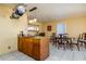 Open-concept kitchen with a center island adjacent to a dining area and tiled flooring at 15212 N 37Th Ave, Phoenix, AZ 85053