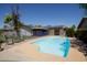 Beautiful backyard pool with patio area, solar panels, and privacy fencing for outdoor enjoyment at 15212 N 37Th Ave, Phoenix, AZ 85053