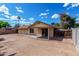 Exterior view of the back of the house with a covered patio at 1643 W Naranja Ave, Mesa, AZ 85202