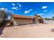 Exterior view of the back of the house with desert landscaping at 1643 W Naranja Ave, Mesa, AZ 85202
