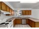 Functional kitchen with stainless steel appliances and plentiful cabinet storage, perfect for cooking at 1643 W Naranja Ave, Mesa, AZ 85202