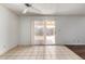 Open floor plan features tile floors and sliding glass doors to the outdoor patio at 1643 W Naranja Ave, Mesa, AZ 85202