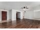 Spacious living room features beautiful wood floors and neutral walls, ready for personalization at 1643 W Naranja Ave, Mesa, AZ 85202