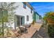 Fully fenced backyard with a patio area, gravel landscaping, and lush greenery at 16875 N 12Th St # 31, Phoenix, AZ 85022