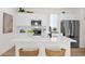 Modern kitchen featuring white cabinetry, stainless steel appliances, and a spacious island with bar seating at 16875 N 12Th St # 31, Phoenix, AZ 85022