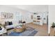 Inviting living room with a cozy sofa, decorative pillows, and a view of the modern kitchen at 16875 N 12Th St # 31, Phoenix, AZ 85022