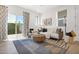 Comfortable living room featuring a sliding glass door leading to an outdoor space and stylish decor at 16875 N 12Th St # 31, Phoenix, AZ 85022