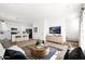 Bright, open living space with modern decor and seamless flow to the kitchen area at 16875 N 12Th St # 31, Phoenix, AZ 85022