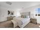 Bright main bedroom featuring neutral tones, a comfortable bed, and stylish furnishings at 16875 N 12Th St # 31, Phoenix, AZ 85022