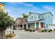 Charming street view of colorful two-story homes featuring covered porches and well-kept landscaping at 16875 N 12Th St # 31, Phoenix, AZ 85022