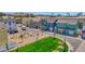 Aerial view of a modern community showcasing colorful homes, lush green spaces, and well-maintained streets at 16875 N 12Th St # 33, Phoenix, AZ 85020