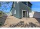 Cozy backyard featuring a patio area, gravel landscaping, and a white fence for privacy at 16875 N 12Th St # 33, Phoenix, AZ 85020