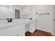 Bright bathroom featuring sleek vanity with modern fixtures, white countertop, and wood-look flooring at 16875 N 12Th St # 33, Phoenix, AZ 85020