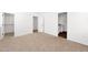 Spacious bedroom with neutral carpet, a walk-in closet, and a bathroom vanity with a mirror at 16875 N 12Th St # 33, Phoenix, AZ 85020