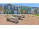 Inviting outdoor community space with modern seating and views of colorful homes on a sunny day at 16875 N 12Th St # 33, Phoenix, AZ 85020