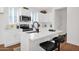 Bright kitchen with white cabinets, stainless steel appliances, and a center island with bar seating at 16875 N 12Th St # 33, Phoenix, AZ 85020