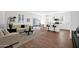 Inviting living space featuring wood floors, comfortable sofas, stylish decor, and an open view to the kitchen at 16875 N 12Th St # 33, Phoenix, AZ 85020