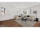 Bright living room with neutral decor, comfortable seating, and a view of the front door and windows at 16875 N 12Th St # 33, Phoenix, AZ 85020