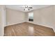 Wood-look floor bedroom, featuring a ceiling fan and window at 1733 N Miller Rd, Scottsdale, AZ 85257