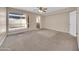 Carpeted bedroom featuring a large window with blinds at 1733 N Miller Rd, Scottsdale, AZ 85257